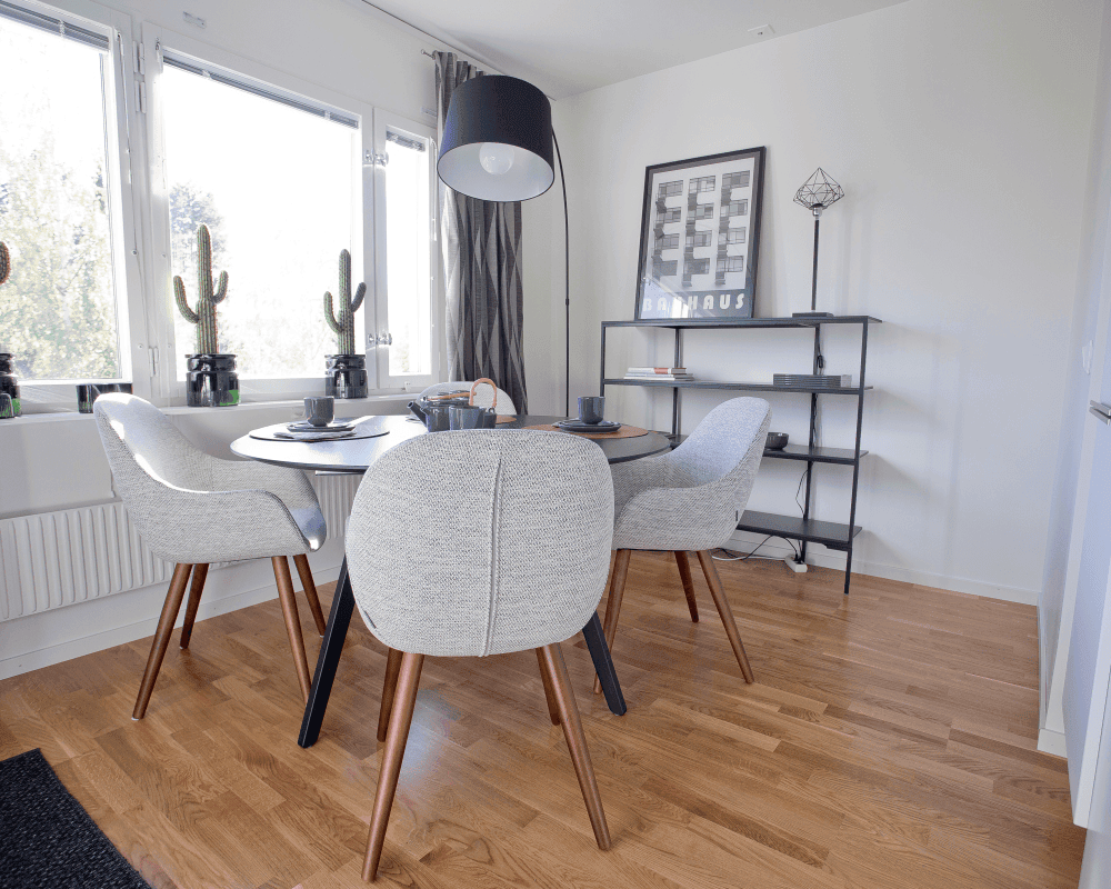 Dining area with four chairs and a round table